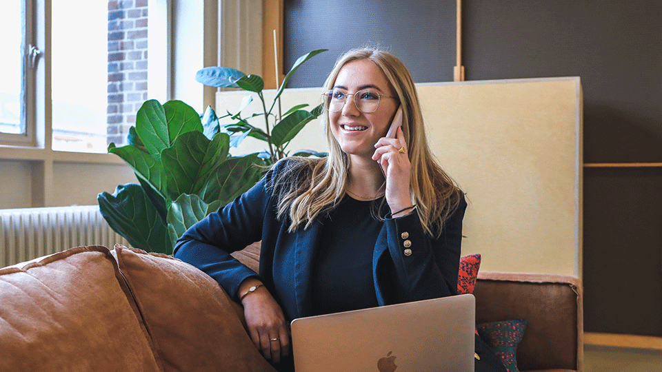Corporate Recruiter On the Phone Sitting on Couch